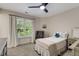 Cozy bedroom featuring neutral tones, large windows with shutters, and comfortable furnishings at 820 Chelsea Park Ne Dr, Marietta, GA 30068