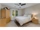 Cozy bedroom with a ceiling fan, natural light, and neutral tones at 820 Chelsea Park Ne Dr, Marietta, GA 30068