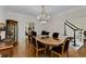 Formal dining room featuring hardwood floors, chandelier, and convenient access to the staircase at 820 Chelsea Park Ne Dr, Marietta, GA 30068
