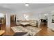 Inviting living room with hardwood floors and comfortable seating, flowing into dining and kitchen areas at 820 Chelsea Park Ne Dr, Marietta, GA 30068