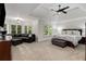 Spacious primary bedroom with sitting area, ceiling fan, and plenty of natural light at 820 Chelsea Park Ne Dr, Marietta, GA 30068
