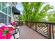 View of the spacious deck with potted flowers, seating, and decorative railings at 11352 Musette Cir, Alpharetta, GA 30009