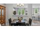 Elegant dining area provides seamless access to the kitchen and features a view of the patio at 11352 Musette Cir, Alpharetta, GA 30009