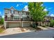 Well-maintained townhome with a deck over a garage, showcasing curb appeal at 11352 Musette Cir, Alpharetta, GA 30009