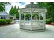 An enclosed gazebo offers a shaded seating area near the community pool at 11352 Musette Cir, Alpharetta, GA 30009