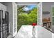 Charming kitchen with a view, showcasing the island and stainless steel fridge near the French doors at 11352 Musette Cir, Alpharetta, GA 30009