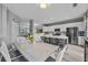 Bright, open kitchen with a large island, stainless steel appliances, and an adjacent dining area, perfect for gatherings at 11352 Musette Cir, Alpharetta, GA 30009
