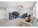 Inviting living room with comfortable seating and a built-in bookshelf, perfect for relaxation and entertainment at 11352 Musette Cir, Alpharetta, GA 30009