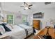The serene primary suite includes a ceiling fan, natural light, and ample space for comfortable living at 11352 Musette Cir, Alpharetta, GA 30009