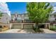 Charming townhomes with two-car garages, wooden decks, and beautiful landscaping create curb appeal at 11352 Musette Cir, Alpharetta, GA 30009