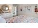 The bedroom showcases a floral comforter, dresser, and unique wall decor at 146 Silver Leaf Trce, Douglasville, GA 30134