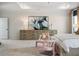 Well-lit bedroom featuring a decorative tray ceiling, a queen size bed and a dresser at 146 Silver Leaf Trce, Douglasville, GA 30134