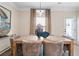 Dining room with large wooden table, accent lighting, and large windows at 146 Silver Leaf Trce, Douglasville, GA 30134