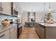 Modern kitchen features stainless appliances, granite countertops, and hardwood floors at 146 Silver Leaf Trce, Douglasville, GA 30134