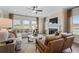 Relaxing living room with large windows, fireplace, and comfortable seating at 146 Silver Leaf Trce, Douglasville, GA 30134