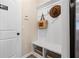 Mudroom features storage bench with coat hooks, and storage baskets at 146 Silver Leaf Trce, Douglasville, GA 30134