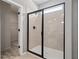 Modern shower room with glass enclosure and a bronze shower head at 146 Silver Leaf Trce, Douglasville, GA 30134