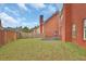 Spacious backyard with well-maintained lawn, perfect for outdoor activities and relaxation at 1498 Park Knoll Trl, Lawrenceville, GA 30043