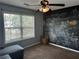 Bedroom with large window, ceiling fan and chalkboard painted wall at 1498 Park Knoll Trl, Lawrenceville, GA 30043