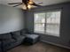 Bedroom featuring a large window and sectional seating at 1498 Park Knoll Trl, Lawrenceville, GA 30043