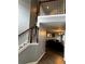 View of the home's light-filled entryway, showcasing the staircase, railing and access to the living room at 1498 Park Knoll Trl, Lawrenceville, GA 30043