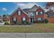 Lovely two-story brick home with manicured landscaping, creating fantastic curb appeal at 1498 Park Knoll Trl, Lawrenceville, GA 30043