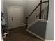 Inviting foyer with a staircase, hardwood floors, and neutral paint offering a bright entry at 1498 Park Knoll Trl, Lawrenceville, GA 30043