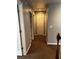 Hallway with three doors and carpeted floor at 1498 Park Knoll Trl, Lawrenceville, GA 30043