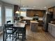 Stylish kitchen with stainless steel appliances, granite countertops, island, and wood flooring at 1498 Park Knoll Trl, Lawrenceville, GA 30043