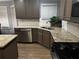 Well-lit kitchen features granite countertops and stainless steel appliances at 1498 Park Knoll Trl, Lawrenceville, GA 30043