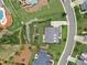 An aerial view of the property showing the layout, landscaping, and proximity to the neighborhood street at 406 Horizon Trl, Canton, GA 30114