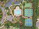 Aerial view of a neighborhood pool, tennis courts, a parking lot, and surrounding greenery at 406 Horizon Trl, Canton, GA 30114