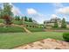 Large backyard with lush landscaping and stone patio at 406 Horizon Trl, Canton, GA 30114