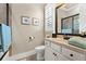 Well-lit bathroom with framed mirror and bathtub-shower combo at 406 Horizon Trl, Canton, GA 30114