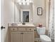 Comfortable bathroom featuring a single sink vanity and toilet at 406 Horizon Trl, Canton, GA 30114