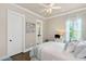 Cozy bedroom with white trim, hardwood floors, and lots of natural light at 406 Horizon Trl, Canton, GA 30114