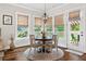 Charming breakfast nook with large windows, wood flooring and backyard view at 406 Horizon Trl, Canton, GA 30114