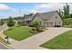 Beautiful home with an attached two-car garage, large driveway, and professionally landscaped front yard at 406 Horizon Trl, Canton, GA 30114