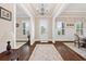 Welcoming foyer with hardwood floors, neutral paint, and views of the dining and living areas at 406 Horizon Trl, Canton, GA 30114