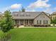 Inviting single-Gathering home boasting a well-maintained lawn, dormer windows, and covered front porch at 406 Horizon Trl, Canton, GA 30114