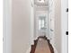 Long hallway with hardwood floors and white trim at 406 Horizon Trl, Canton, GA 30114