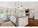 Open concept kitchen with island, stainless appliances, and seamless flow to living area with fireplace at 406 Horizon Trl, Canton, GA 30114