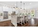 Bright kitchen with stainless steel appliances, double oven, kitchen island, and views of breakfast nook at 406 Horizon Trl, Canton, GA 30114
