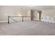 Spacious upstairs loft with neutral walls and carpet flooring at 406 Horizon Trl, Canton, GA 30114