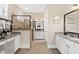 Luxurious bathroom with double vanities and a glass shower enclosure at 406 Horizon Trl, Canton, GA 30114