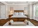 Spacious main bedroom showcasing a decorative bench and warm, ambient lighting at 406 Horizon Trl, Canton, GA 30114