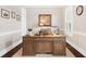 Home office features a large wooden desk, plantation shutters, and neutral paint at 406 Horizon Trl, Canton, GA 30114