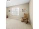 This bedroom features neutral walls, plush carpeting, and natural light streaming through plantation shutters at 4595 Carriage Walk Ln, Cumming, GA 30040