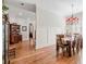 Elegant dining room with hardwood floors and chandelier lighting fixture, perfect for entertaining guests at 4595 Carriage Walk Ln, Cumming, GA 30040