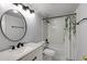 Bathroom featuring a shower and tub combination with marble tile surround and updated vanity at 795 Hammond Dr # 503, Sandy Springs, GA 30328